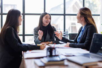 Wall Mural - Business adviser meeting to analyze and discuss the situation on the financial report in the Asian meeting room.Investment Consultant, Financial advisor and accounting concept
