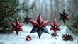 © neiros - Hanging red and black stars are a beautiful sight in the winter pine forest