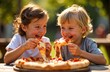 © Krystsina - Happy children enjoy pizza outdoors.