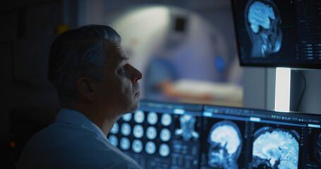 Aufkleber - Close-up Portrait of Professional Doctor Looking at MRI or CT Scan Images on His Computer Monitor, Searching for Signs of Brain Tumor or Cancer, Trying to Diagnose Disease