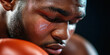 © Lila Patel - Close-up of a Sweating Boxer's Face with Injury