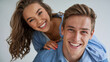 © Inspire Shots Hub - A cheerful young man and woman in casual blue shirts smiling and posing together, enjoying each otherâ€™s company in a bright and happy moment that represents love and friendship.