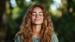 © Dulemegapixel - A serene woman with a gentle smile signifies mindfulness, surrounded by the tranquility of nature's greens, emphasizing the importance of inner peace and happiness.