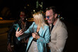 © liderina - Group of Multi-Ethnicity people having fun outdoor in the night. Celebrate.