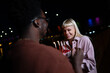 © liderina - Group of Multi-Ethnicity people having fun outdoor in the night. Celebrate.