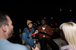 © liderina - Group of Multi-Ethnicity people having fun outdoor in the night. Celebrate.