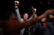 © liderina - Group of Multi-Ethnicity people having fun outdoor in the night. Celebrate.