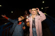 © liderina - Group of Multi-Ethnicity people having fun outdoor in the night. Celebrate.