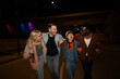 © liderina - Group of Multi-Ethnicity people having fun outdoor in the night. Celebrate.