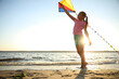 © New Africa - Cute little child playing with kite on beach near sea at sunset. Spending time in nature
