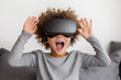 © kazakova0684 - A close-up of a child wearing VR glasses, showing excitement and wonder