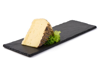 Wall Mural - Aged cheese wedge with natural rind and lettuce, isolated on white background.