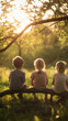 © Michael - Young siblings perching on weathered tree log, watching golden sunset, sharing serene outdoor moment among natural landscape