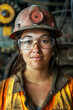 © connel_design - Young female worker smiling with safety gear.