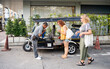 © ADDICTIVE STOCK - Thai tuk tuk driver assisting female tourists in Chiang Rai