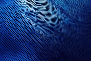Blue Perforated Material Flows Smoothly with Abstract Design Theme.