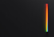 © trustmastertx - Vibrant rainbow light streak on dark background.