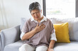 © KMPZZZ - Chest pain, attack chest, emergency heartbeat asian senior woman holding hand on chest, suffering symptom from pain, heart disease problem of aged anxiety cardiac. Health care of cardiology concept.