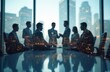 © Vadym - Blurred silhouettes of business team meeting against city office building background. Double exposure highlights partnership success, teamwork, urban office life. Corporate group discussion, global