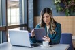 © PAPPUS_STORE - Focused Businesswoman Using Tablet in Modern Office Setting