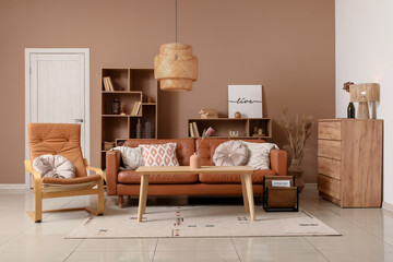 Wall Mural - Interior of living room with cozy sofa, coffee table and armchair