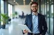© Shah - Successful Entrepreneur Holding Digital Tablet in Office
