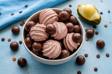 Wall Mural - Chocolate meringue cookies in a bowl with choco drops