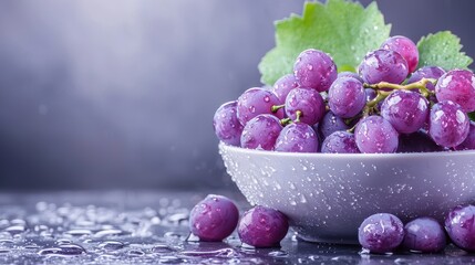 Wall Mural - a bowl of fresh, ripe grapes of various purple shades, with water droplets clinging to their skins, 