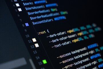 close-up of computer screen with colorful css code, focus on root selector, web development, fronten