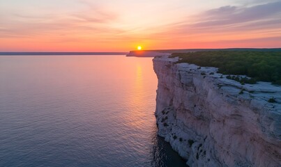 Wall Mural - A breathtaking sunrise over the cliffs, with golden rays illuminating the vast ocean below. Generative AI