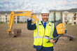 © Volodymyr - Engineer, construction manager or supervisor at a construction. Supervisor in suit and helmet. Investor, construction manager at a construction. Developer, outdoor portrait . Middle aged architect.