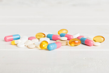 Wall Mural - Collection Of Various Medical Tablets And Pills. Assorted pharmaceutical medicine pills, tablets and capsules on table background. Heap of assorted various medicine tablets. Health care