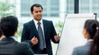 © Jo - Indian Business Leader Presenting in Office Meeting