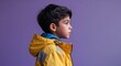 © sevenSkies - Kid Hispanic boy in plain purple background brown boots side view portrait