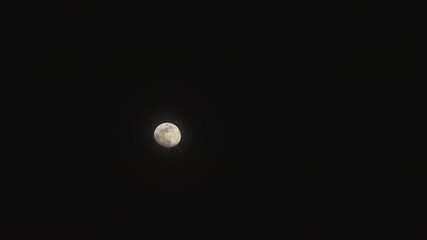 Wall Mural - Moon moving up with a dark background