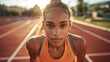 © Z A C - A female athlete posing at a track.