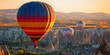 © bborriss - Hot air balloons flying over cappadocia at sunrise in turkey