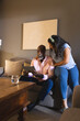 © Wavebreak Media - senior diverse couple enjoying tablet together on couch, sharing joyful moment, at home