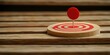© SabsePahale - Targeted Precision: A close-up of a wooden target with a bold red bullseye and a matching red marker pin, resting on a rustic wooden surface. The image conveys a sense of accuracy, achievement.