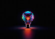 © YiuCheung - A glowing light bulb constructed from interconnected circuit board components emits vibrant colorful lights in a dark space, symbolizing innovative digital technology.
