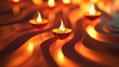 © gentho - Glowing diyas on wavy surface, warm light, festive mood.