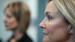 © Ghiska - Focused Woman, colleague blurred, office, meeting