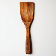 A unique wooden spatula featuring a rich, warm grain, set against a minimalist white backdrop for culinary designs, showcasing natural kitchenware aesthetics.