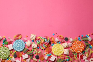 Wall Mural - Different delicious candies and marshmallows on pink background, flat lay. Space for text