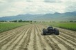 © fpolat69 - A large field plowed and sprayed with robot technology