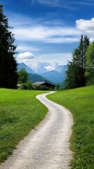 Wall Mural - Colorful wildflowers adorn a lush green valley surrounded by distant mountains under a clear blue summer sky