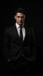 © NARUMOL - Elegant man in black suit with confident expression