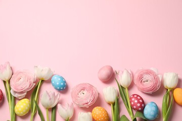 Wall Mural - Easter eggs and beautiful spring flowers on pink background, flat lay. Space for text