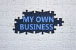 © Natallia - My own Business symbol. Concept words My own Business on white puzzle. Beautiful deep blue background Business and My own Business concept. Copy space.