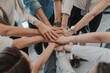 © BOTAHRY DEX - Teamwork concept with diverse hands joining together, symbolizing unity, cooperation, and collaboration